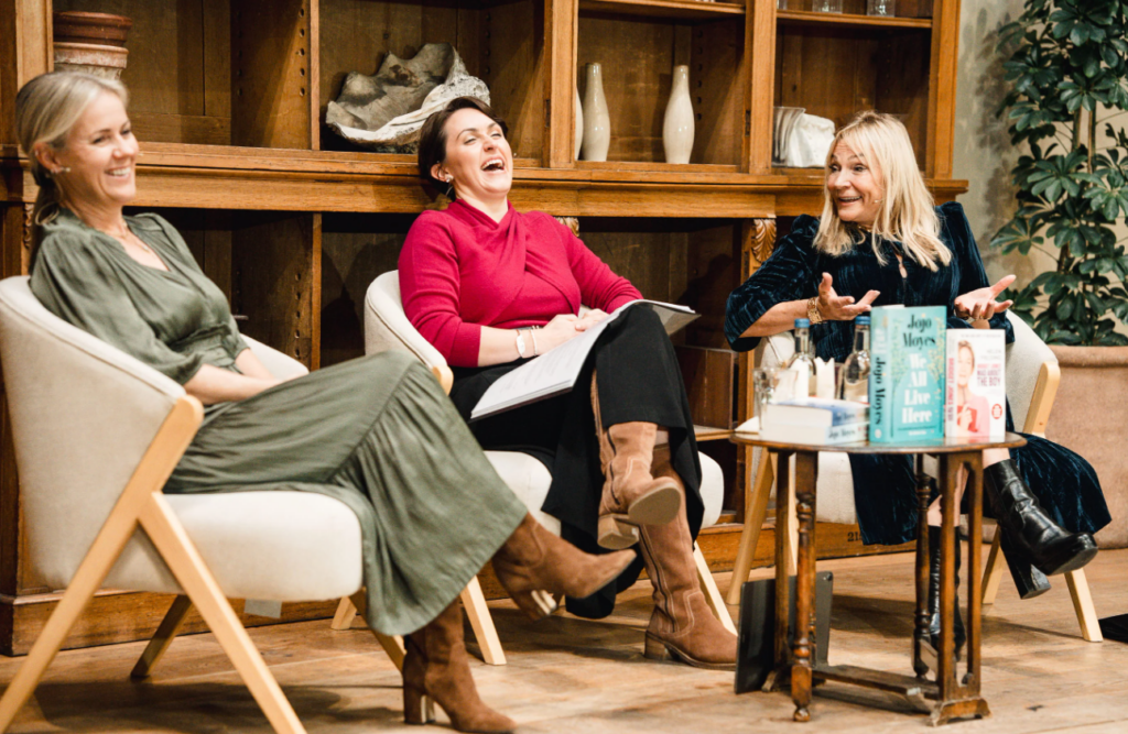 three ladies laughing as part of the queens reading room